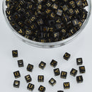 6mm Black Alphabet Cube Beads with Gold Letters, x500 acrylic beads bac0372