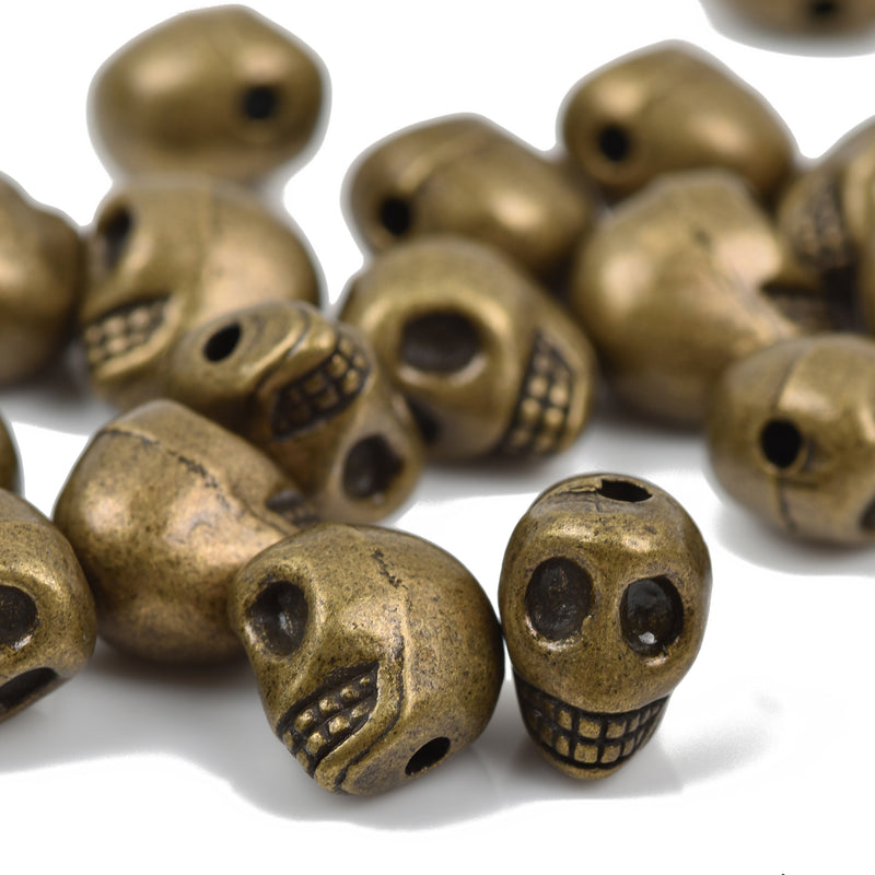 10 Bronze Metal SKULL Beads, drilled top to bottom, 12mm, bme0403