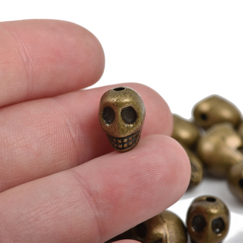 10 Bronze Metal SKULL Beads, drilled top to bottom, 12mm, bme0403