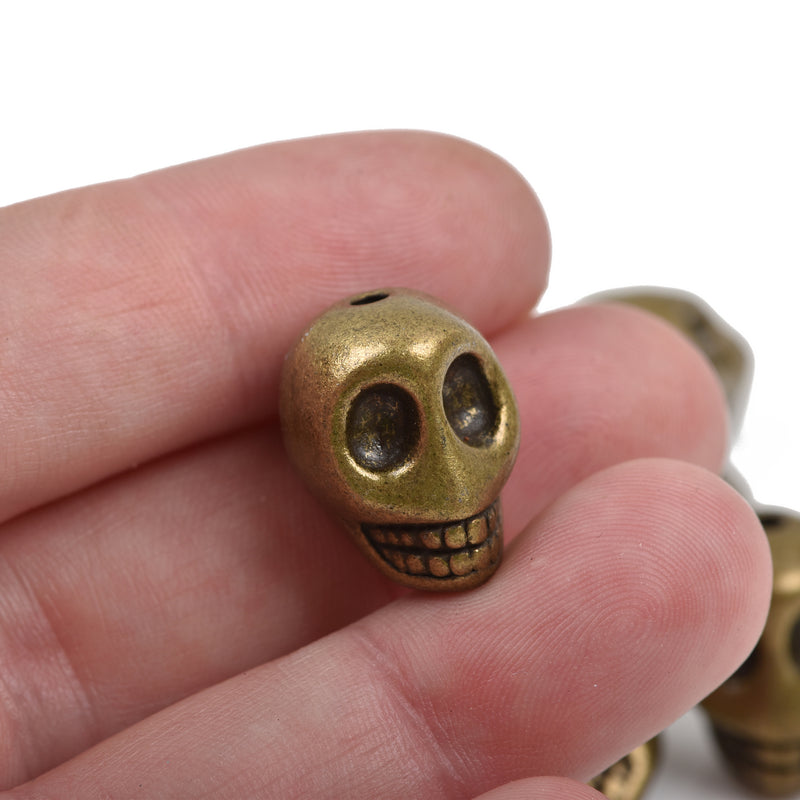 5 Bronze Metal SKULL Beads, drilled top to bottom, 18mm, bme0398
