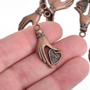 10 Copper Metal Love Heart in Hand Charm Pendants Chs4131
