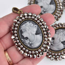 Cameo Pendant with silver crystals and faux pearls, bronze oval 2.5" long, chs7607