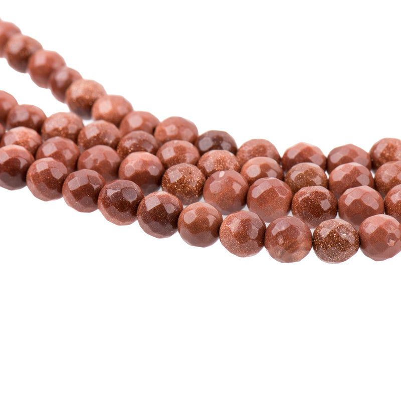 GOLDSTONE Round Faceted Beads 6mm . 1 long strand . about 65 beads ggs0006