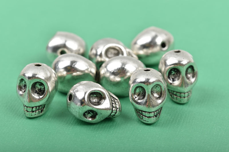 10 Silver Metal SKULL Beads, drilled top to bottom, 12mm, bme0401