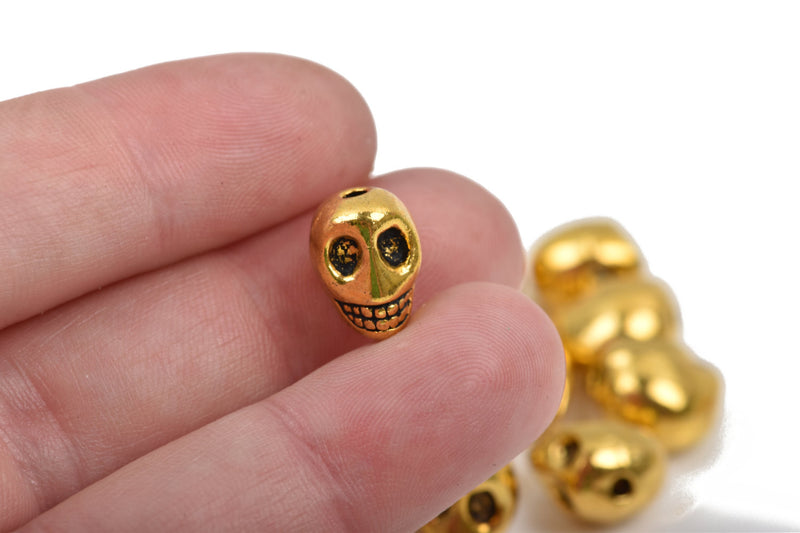 10 Gold Metal SKULL Beads, drilled top to bottom, 12mm, bme0404