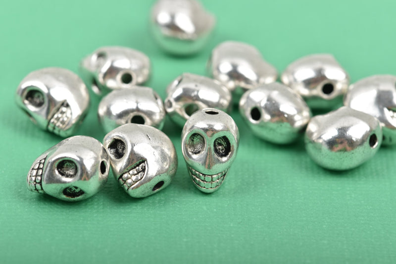 10 Silver Metal SKULL Beads, drilled top to bottom, 12mm, bme0401