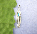 10 Turquoise FEATHER CHARMS . pewter with turquoise enamel accent che0232a