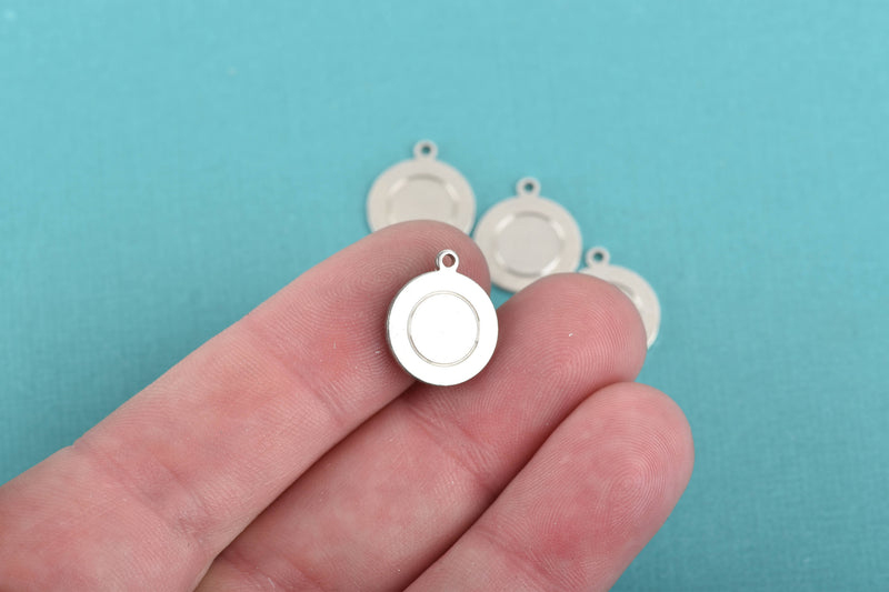 10 Alkeme™ Border Circle Disc Charm, silver metal stamping blanks with top loop, 13mm (1/2") 18 gauge, msb0440