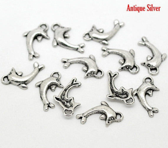10 Silver Tibetan Style Metal DOLPHIN Charm Pendants . 19mm x 11mm   chs0787