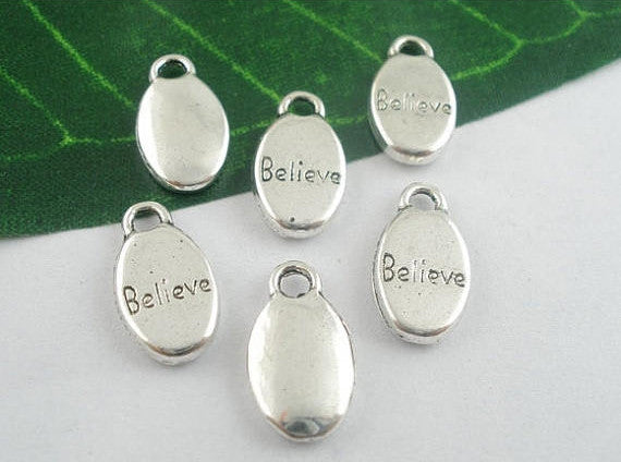 10 Oval BELIEVE Pewter Charm Pendants . chs0373