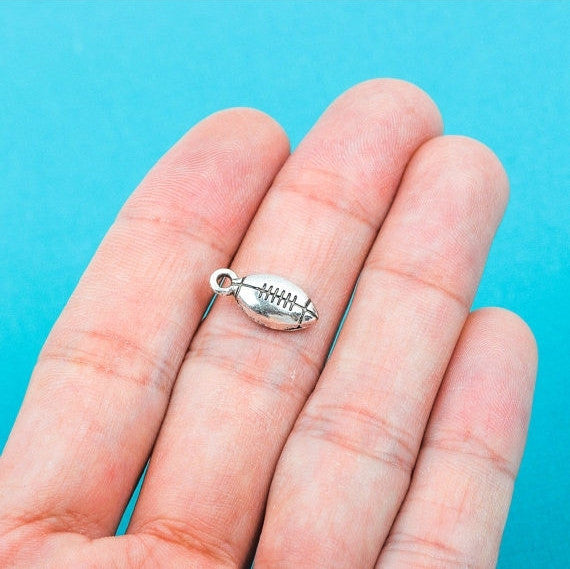 10 Silver Tone Metal FOOTBALL Charm Pendants chs0155