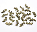 10 Small Antique Bronze BOW 2-Hole Connector Charm Pendants. CHB0073