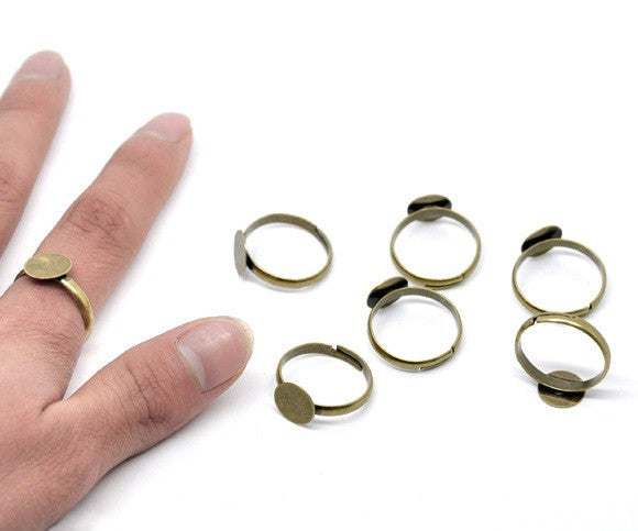 10 Antique Bronze metal Ring Base Blank . Glue-on . Size 8 adjustable. fin0264