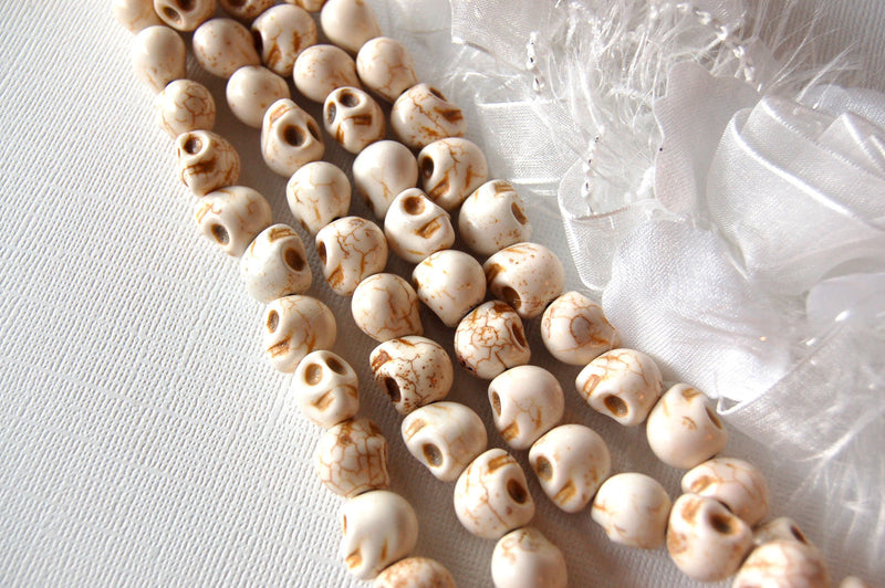 Ghostly White Howlite SUGAR SKULLS Gemstone Beads . 1 long strand . approx 33 beads . carved stone how0387