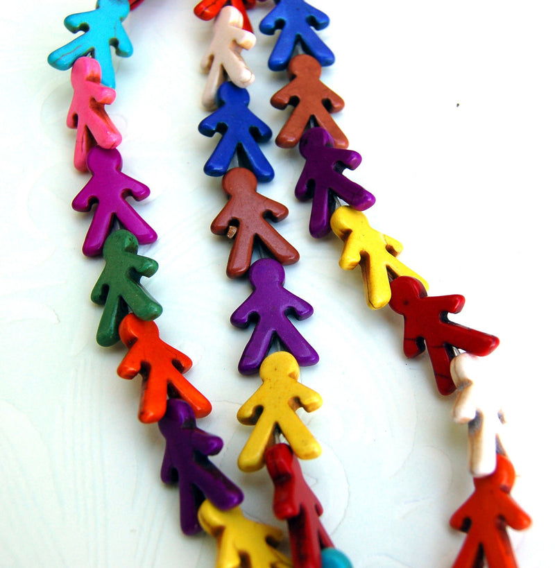 1 Strand Howlite Stone Beads in the shape of a BOY . 22mm x 16mm, drilled top to bottom  HOW0103