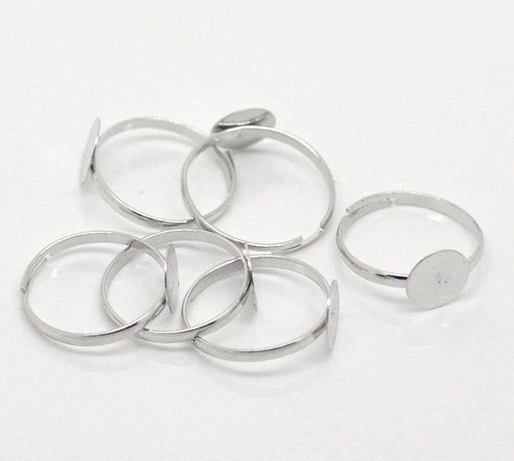 20 Silver Tone Metal Ring Blanks . Thin Band . size 7.5-9.5, adjustable. fin0271