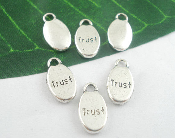 10 Oval TRUST Pewter Charm Pendants . chs0079