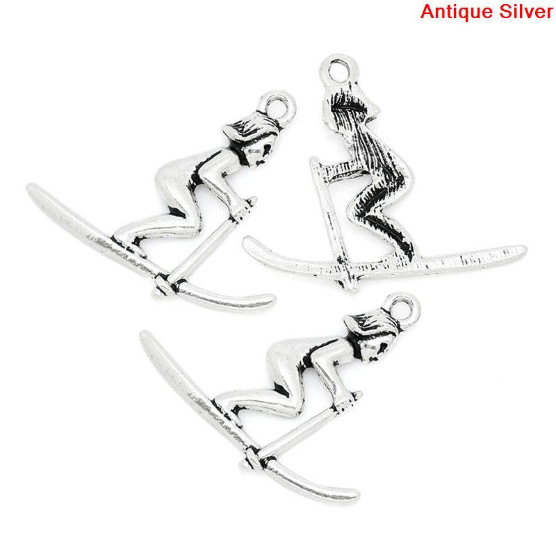 4 SKIER Antique Silver Tone Metal Charm Pendants . (one sided, flat back design)  chs0590