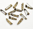 25 Antique Bronze Metal Pin Backs, 20mm x 5mm. FIN0001