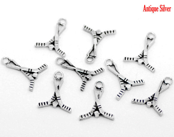 10 Silver Tone Hockey Sticks and Puck Charms Pendants . chs0089