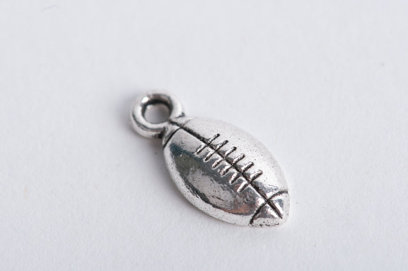 10 Silver Tone Metal FOOTBALL Charm Pendants chs0155