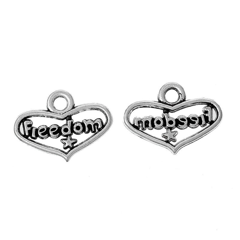 10 Small Silver Tone FREEDOM Heart Cut Out Charms Pendants chs1170