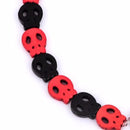 1 Strand Small Flat Howlite Orange and Black Halloween SUGAR SKULLS Gemstone Beads  15mm, carved stone how0282