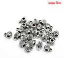 100 Silver Tone Bail Beads, flower pattern carved in the design, 9x6mm, fba0054