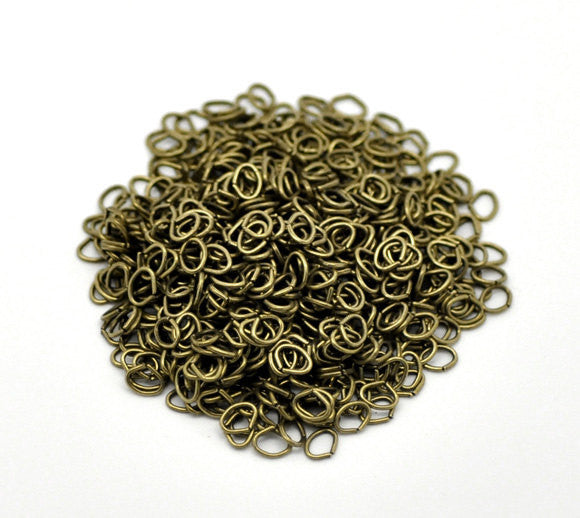 50 OVAL Bronze Open Jump Rings 5mm x 4mm, 21 gauge wire,  jum0157a